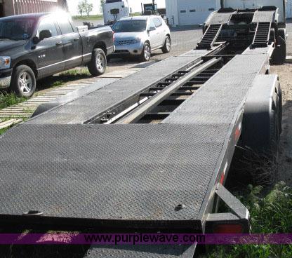 image for item 6235 1997 Hide-A-Bed triple axle gooseneck flatbed trailer