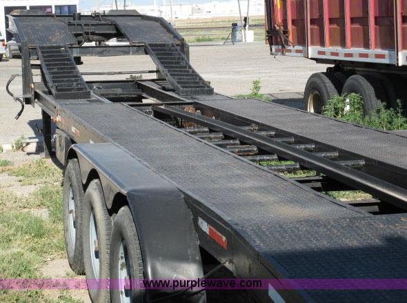 image for item 6235 1997 Hide-A-Bed triple axle gooseneck flatbed trailer