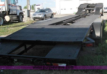 image for item 6235 1997 Hide-A-Bed triple axle gooseneck flatbed trailer