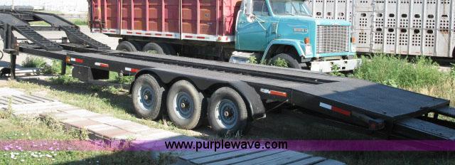 image for item 6235 1997 Hide-A-Bed triple axle gooseneck flatbed trailer