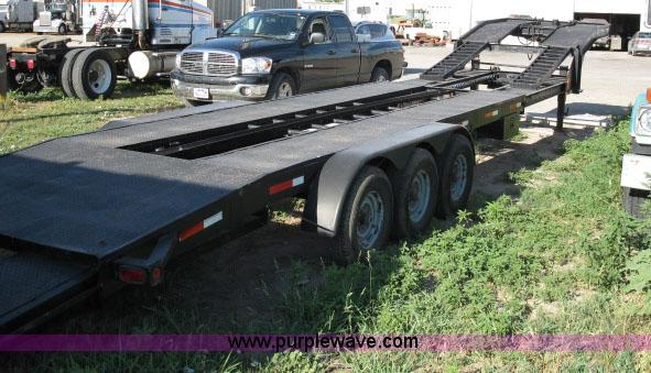 image for item 6235 1997 Hide-A-Bed triple axle gooseneck flatbed trailer