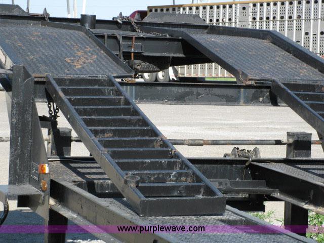 image for item 6235 1997 Hide-A-Bed triple axle gooseneck flatbed trailer