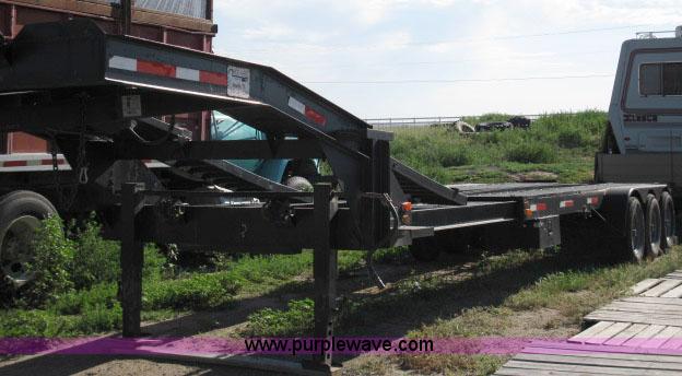image for item 6235 1997 Hide-A-Bed triple axle gooseneck flatbed trailer
