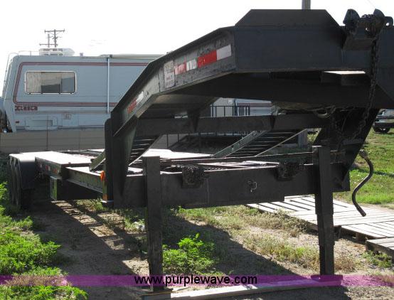 image for item 6235 1997 Hide-A-Bed triple axle gooseneck flatbed trailer