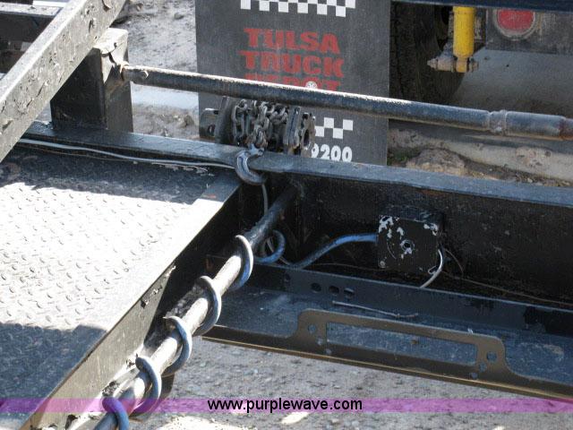 image for item 6235 1997 Hide-A-Bed triple axle gooseneck flatbed trailer