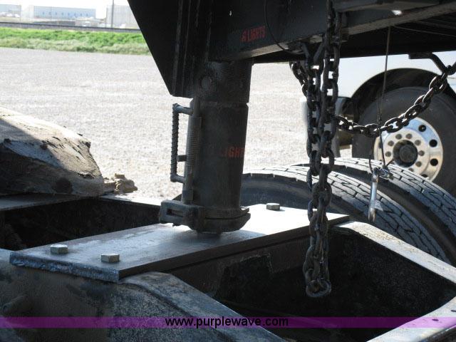 image for item 6235 1997 Hide-A-Bed triple axle gooseneck flatbed trailer