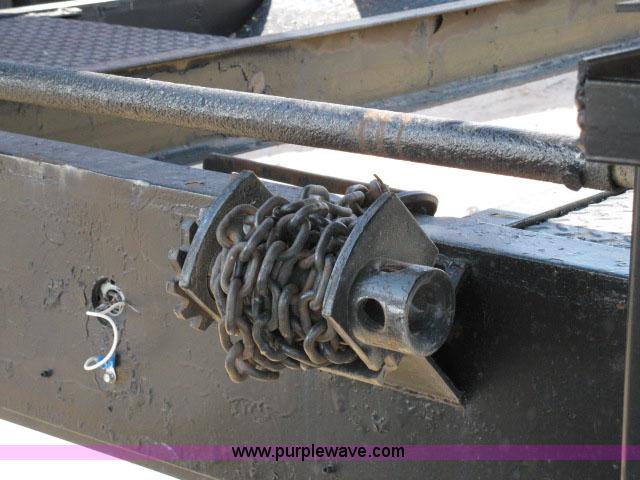 image for item 6235 1997 Hide-A-Bed triple axle gooseneck flatbed trailer