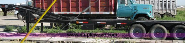 image for item 6235 1997 Hide-A-Bed triple axle gooseneck flatbed trailer