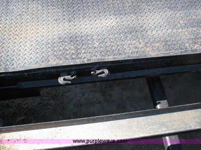 image for item 6235 1997 Hide-A-Bed triple axle gooseneck flatbed trailer