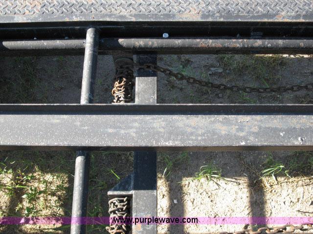 image for item 6235 1997 Hide-A-Bed triple axle gooseneck flatbed trailer