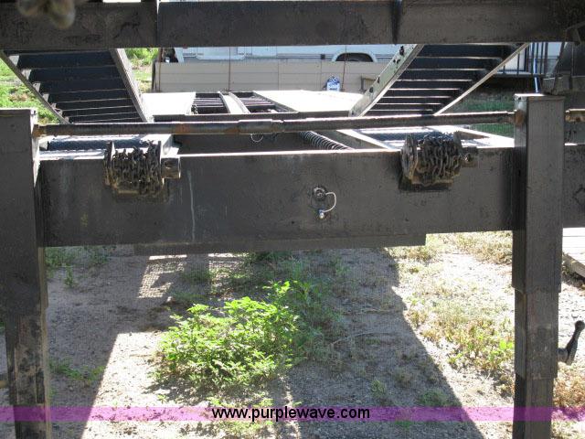 image for item 6235 1997 Hide-A-Bed triple axle gooseneck flatbed trailer