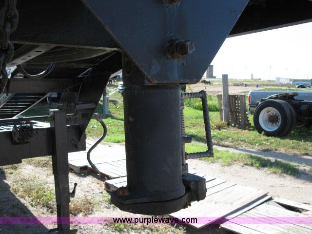 image for item 6235 1997 Hide-A-Bed triple axle gooseneck flatbed trailer
