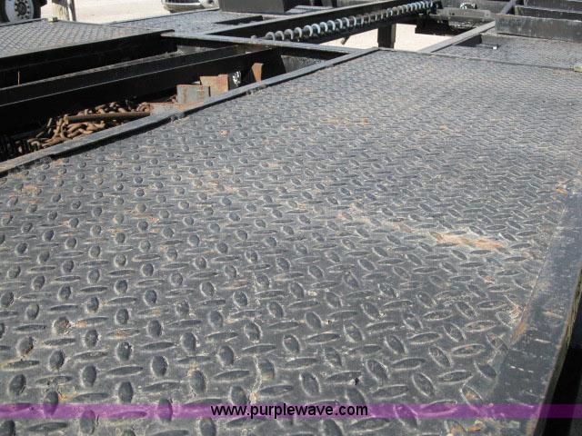 image for item 6235 1997 Hide-A-Bed triple axle gooseneck flatbed trailer