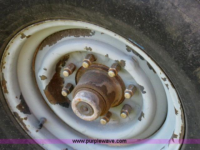 image for item 6235 1997 Hide-A-Bed triple axle gooseneck flatbed trailer