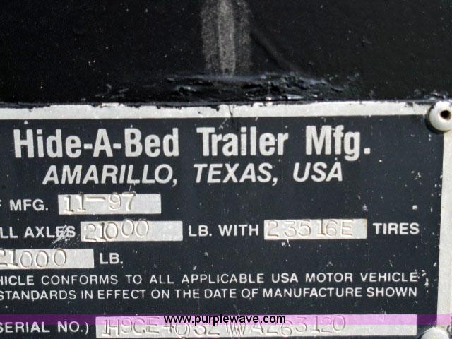 image for item 6235 1997 Hide-A-Bed triple axle gooseneck flatbed trailer