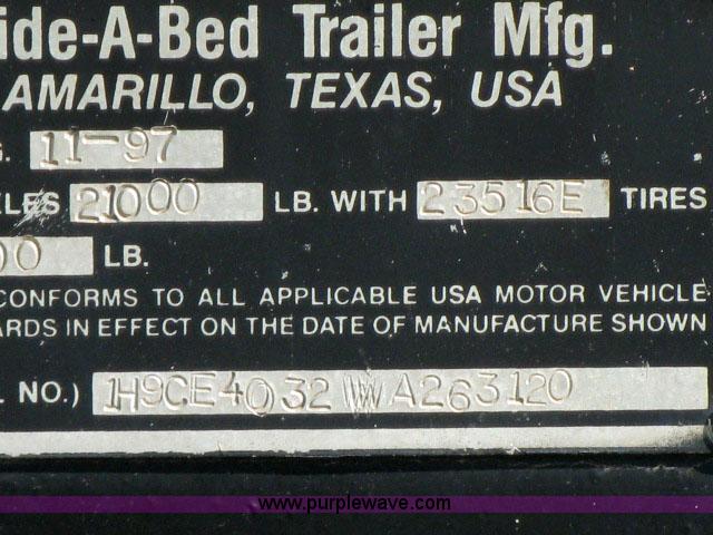 image for item 6235 1997 Hide-A-Bed triple axle gooseneck flatbed trailer