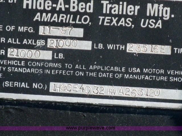 image for item 6235 1997 Hide-A-Bed triple axle gooseneck flatbed trailer