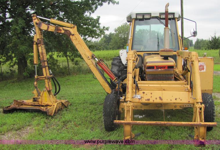 image for item 3054 1989 Ford 6610 Tiger Special tractor with 52" side boom mower