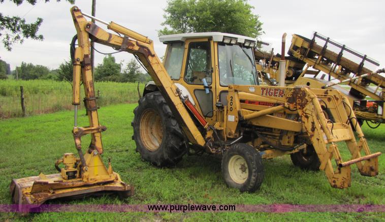 image for item 3054 1989 Ford 6610 Tiger Special tractor with 52" side boom mower