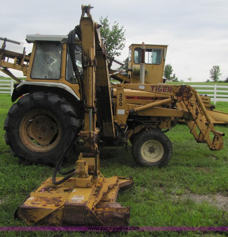 image for item 3054 1989 Ford 6610 Tiger Special tractor with 52" side boom mower