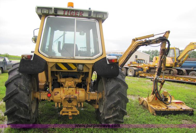image for item 3054 1989 Ford 6610 Tiger Special tractor with 52" side boom mower
