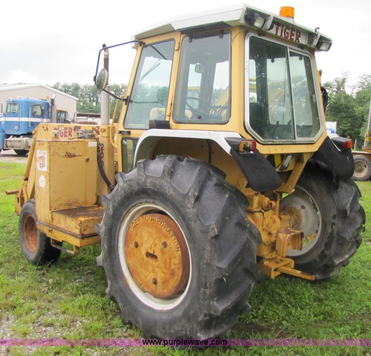 image for item 3054 1989 Ford 6610 Tiger Special tractor with 52" side boom mower