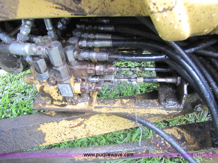 image for item 3054 1989 Ford 6610 Tiger Special tractor with 52" side boom mower