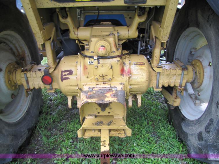 image for item 3054 1989 Ford 6610 Tiger Special tractor with 52" side boom mower