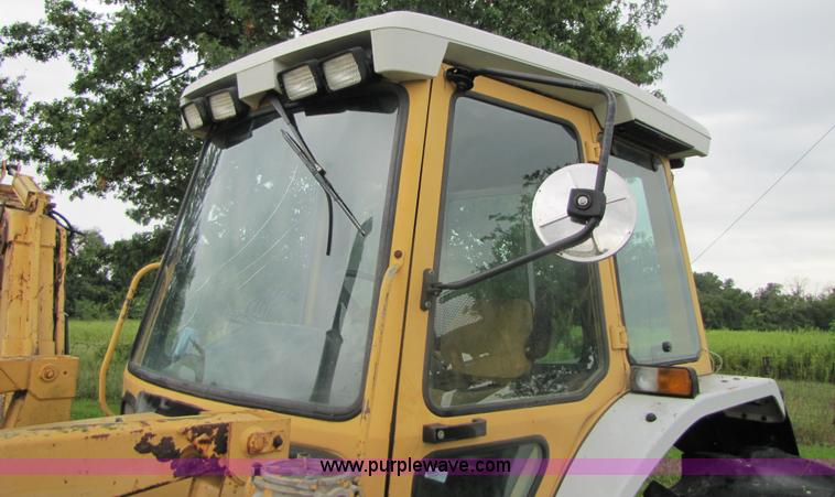 image for item 3054 1989 Ford 6610 Tiger Special tractor with 52" side boom mower