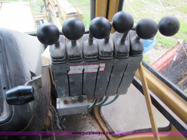 image for item 3054 1989 Ford 6610 Tiger Special tractor with 52" side boom mower