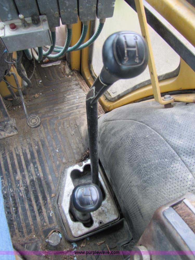 image for item 3054 1989 Ford 6610 Tiger Special tractor with 52" side boom mower