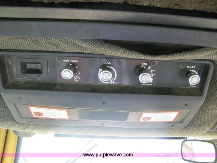 image for item 3054 1989 Ford 6610 Tiger Special tractor with 52" side boom mower