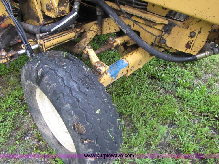 image for item 3054 1989 Ford 6610 Tiger Special tractor with 52" side boom mower