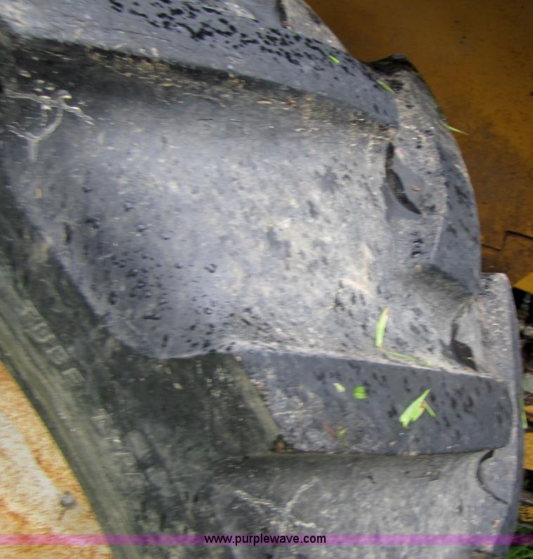 image for item 3054 1989 Ford 6610 Tiger Special tractor with 52" side boom mower