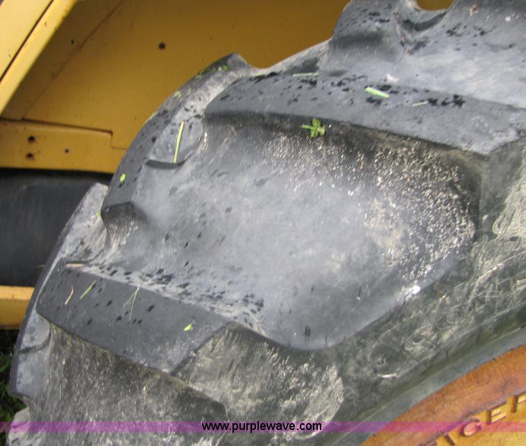 image for item 3054 1989 Ford 6610 Tiger Special tractor with 52" side boom mower