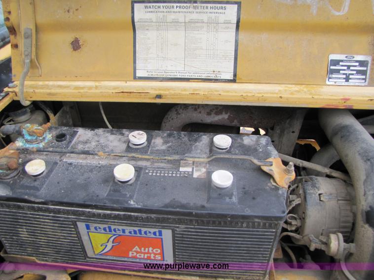 image for item 3054 1989 Ford 6610 Tiger Special tractor with 52" side boom mower