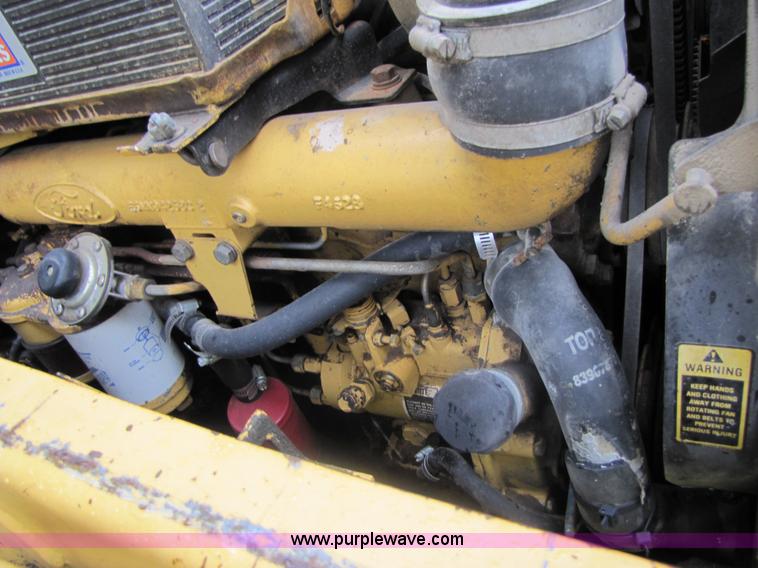 image for item 3054 1989 Ford 6610 Tiger Special tractor with 52" side boom mower