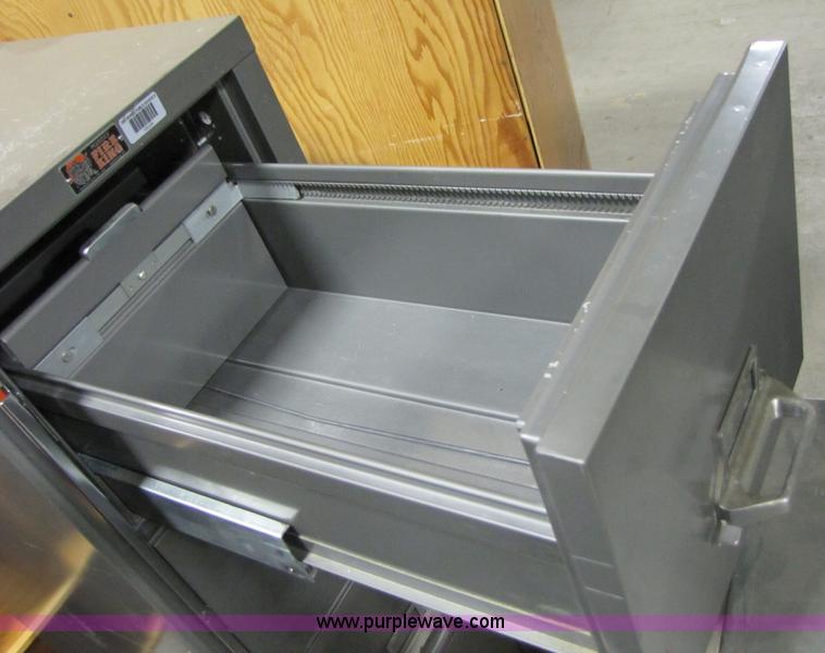 image for item 3558 Fire King four drawer fireproof file cabinet