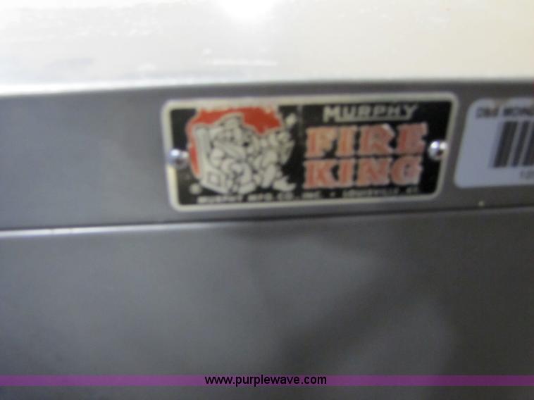 image for item 3558 Fire King four drawer fireproof file cabinet