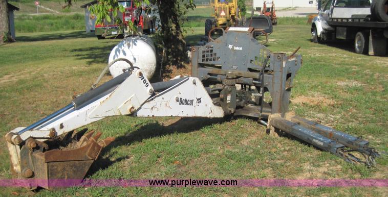 image for item 3027 Bobcat 709 back hoe skid steer attachment