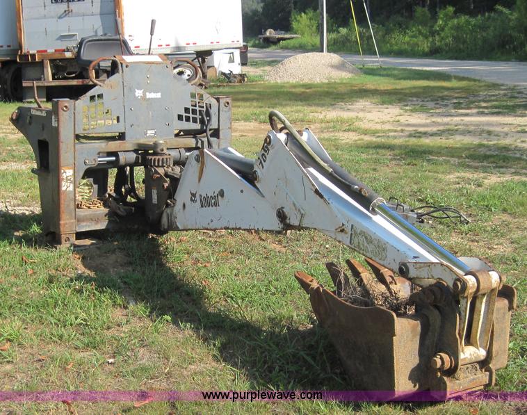 image for item 3027 Bobcat 709 back hoe skid steer attachment