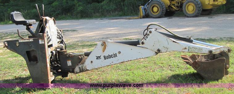image for item 3027 Bobcat 709 back hoe skid steer attachment