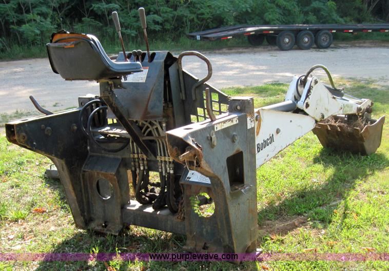 image for item 3027 Bobcat 709 back hoe skid steer attachment