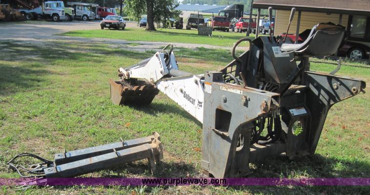 image for item 3027 Bobcat 709 back hoe skid steer attachment