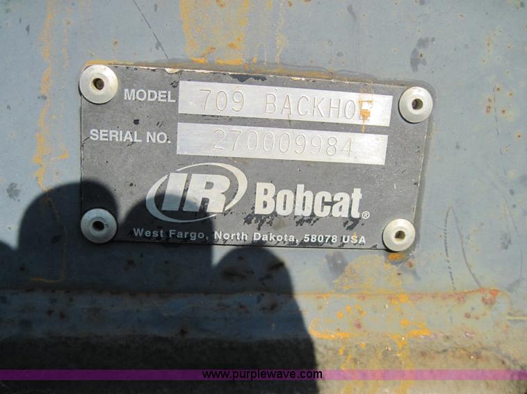 image for item 3027 Bobcat 709 back hoe skid steer attachment
