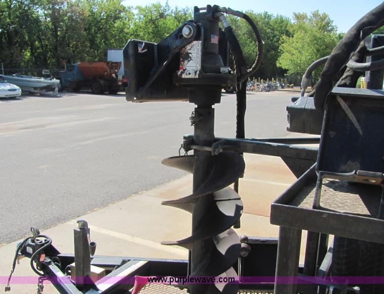 image for item 4828 2004 Powerhouse Pro mini skid-steer loader with attachments and customer trailer