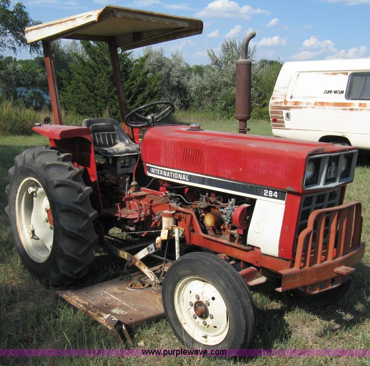 image for item 5065 International 284 tractor with 72" belly mower