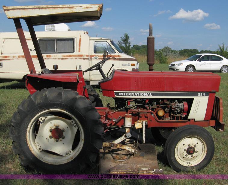 image for item 5065 International 284 tractor with 72" belly mower