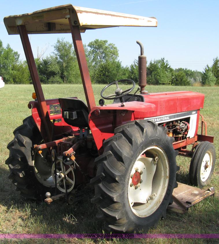 image for item 5065 International 284 tractor with 72" belly mower