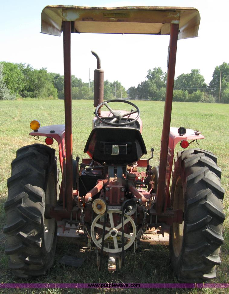 image for item 5065 International 284 tractor with 72" belly mower